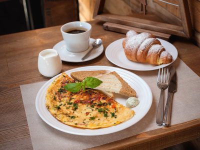 breakfast. Omelet with greens, croissant and coffee